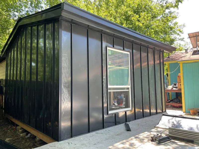 Black standing seam metal wall panels for Metal Roof Installation in Bow